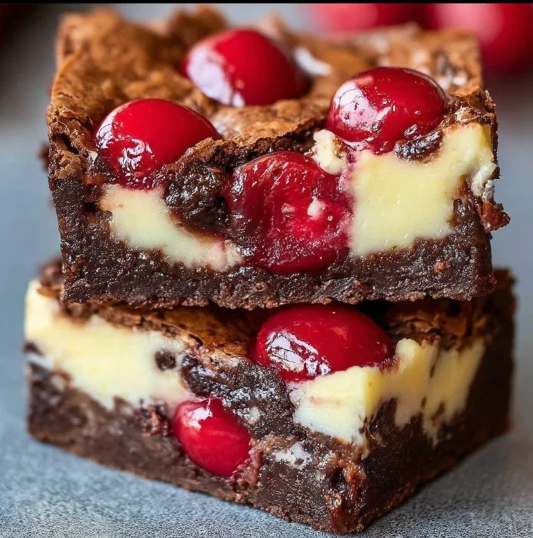 Delicious Cherry Cheesecake Brownies layered with chocolate and cheesecake