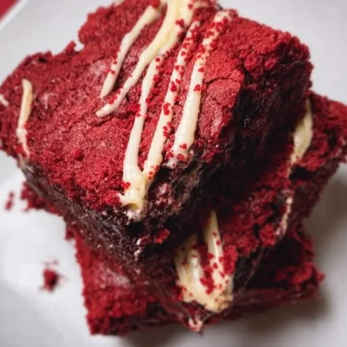 Delicious red velvet brownies topped with cream cheese frosting