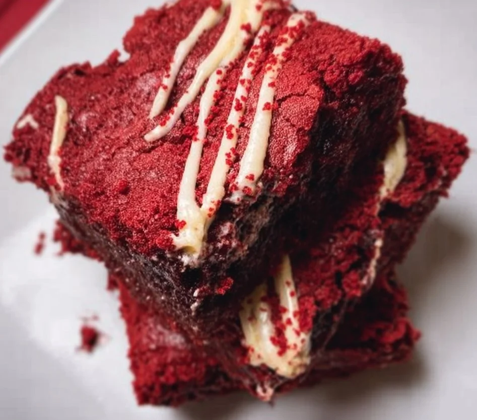Delicious red velvet brownies topped with cream cheese frosting