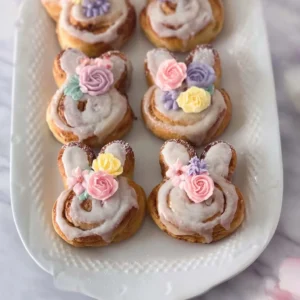 Easter Bunny cinnamon rolls decorated with icing and pastel colors