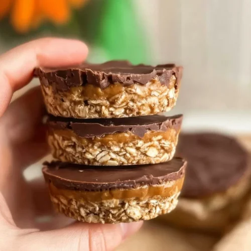 Homemade Peanut Butter Oat Cups topped with chocolate and nuts