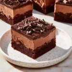 Delicious Chocolate Mousse Brownies topped with rich chocolate ganache