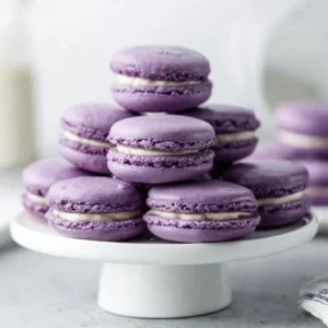 A beautifully arranged platter of colorful French macarons.