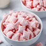 Quick Strawberry Shortcake Puppy Chow dessert recipe with strawberry flavor.